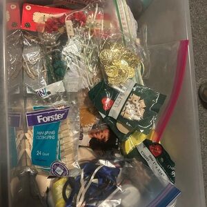 Box of miscellaneous crafting and sewing supplies.